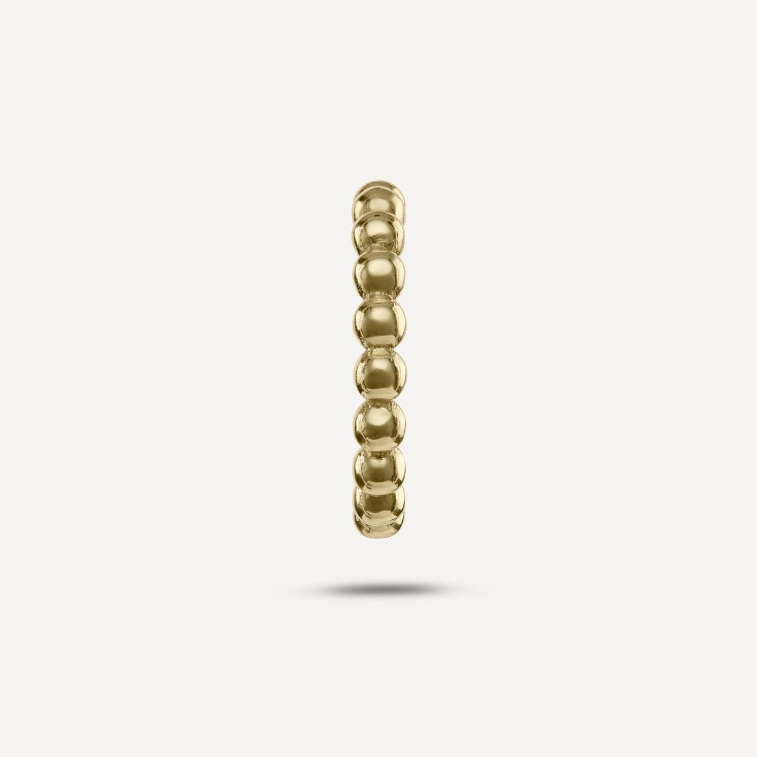 Earcuff aus kleinen goldenen Kugeln;